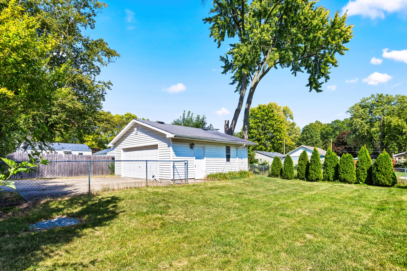 702 North Walnut Street Normal, IL 61761 - Photo 38 of 45 a view of a house with garden and a tree