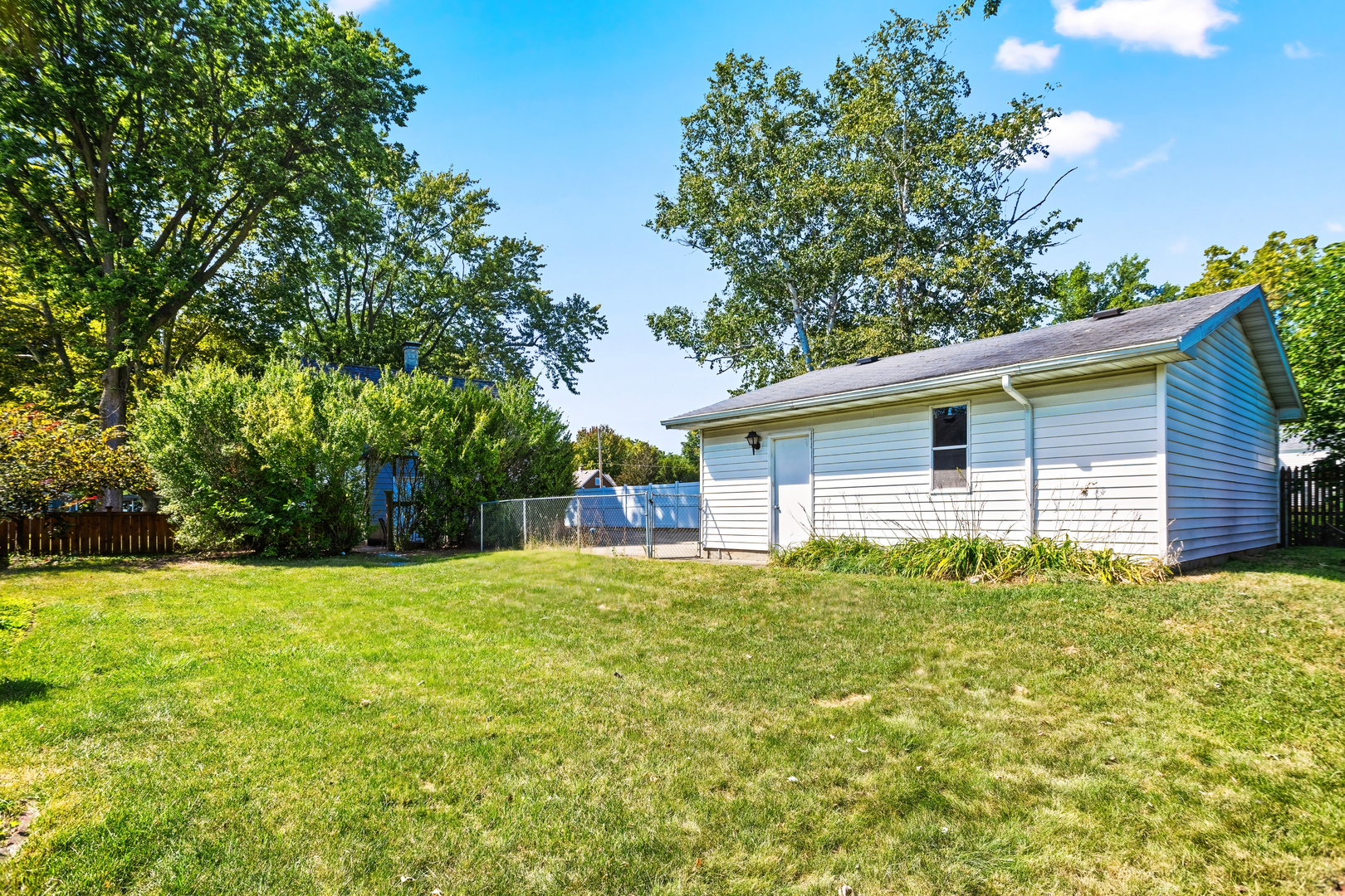 702 North Walnut Street Normal, IL 61761 - Photo 39 of 45 a house with trees in the background