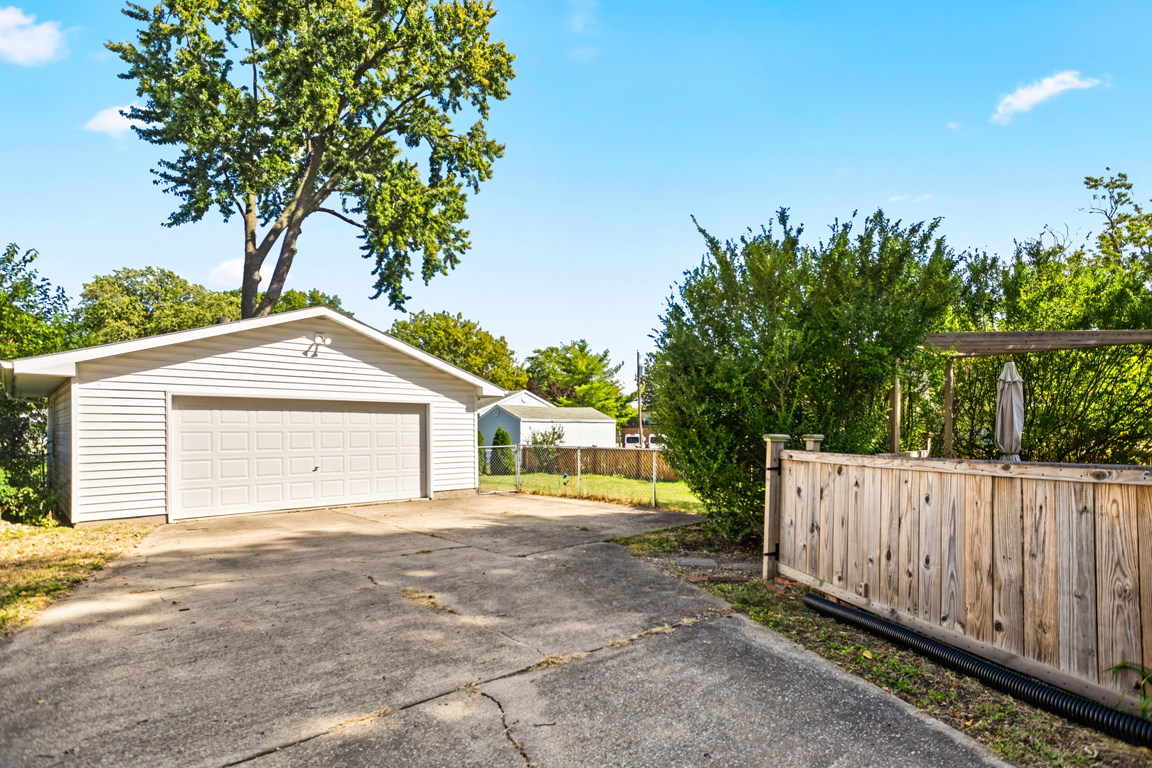 702 North Walnut Street Normal, IL 61761 - Photo 42 of 45 a view of a house with a backyard and a garden