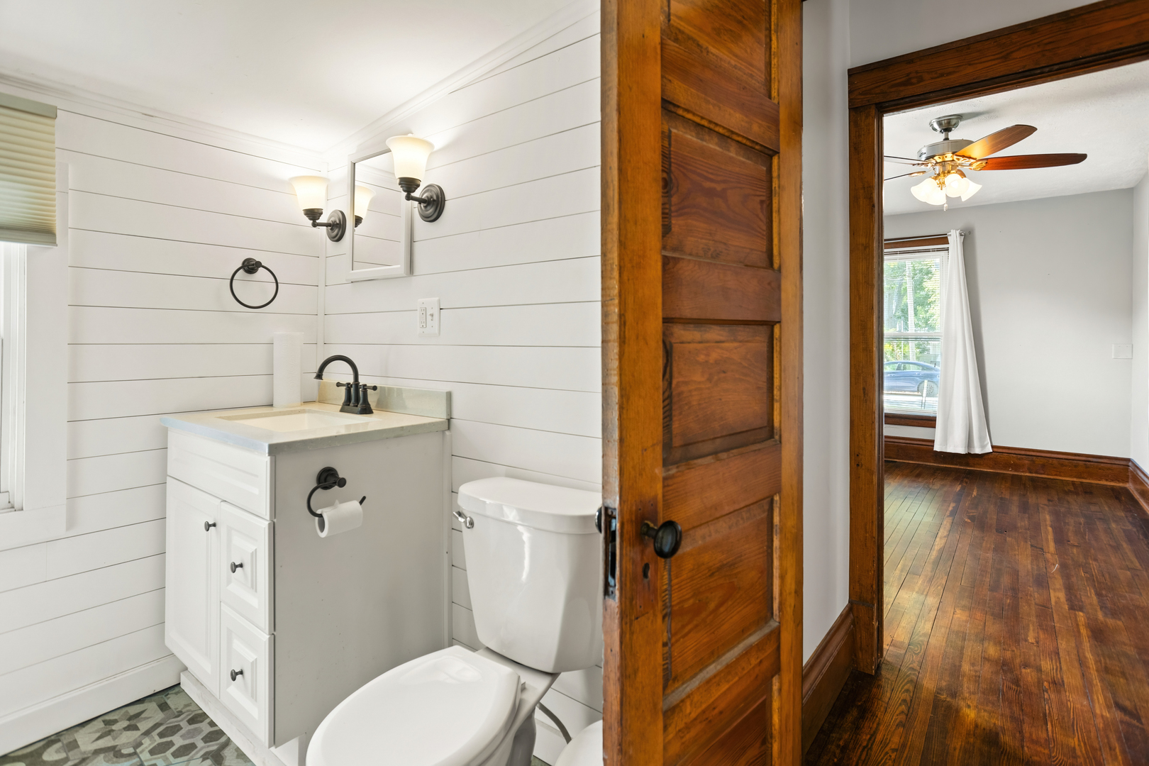 702 North Walnut Street Normal, IL 61761 - Photo 7 of 45 a bathroom with a toilet and a sink