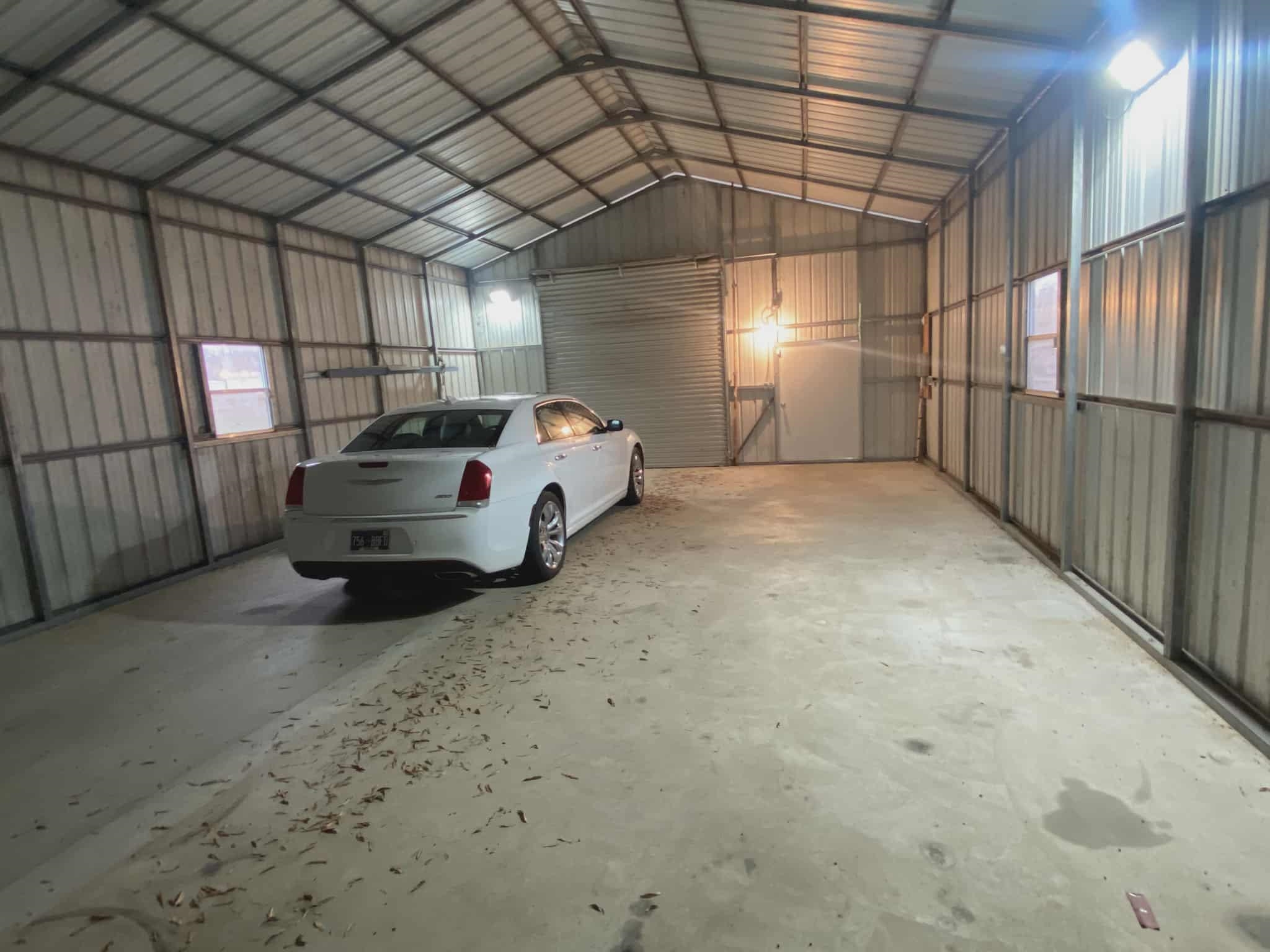 175 Austin Street Savannah, TN 38372 - Photo 23 of 33 a garage with a car parked