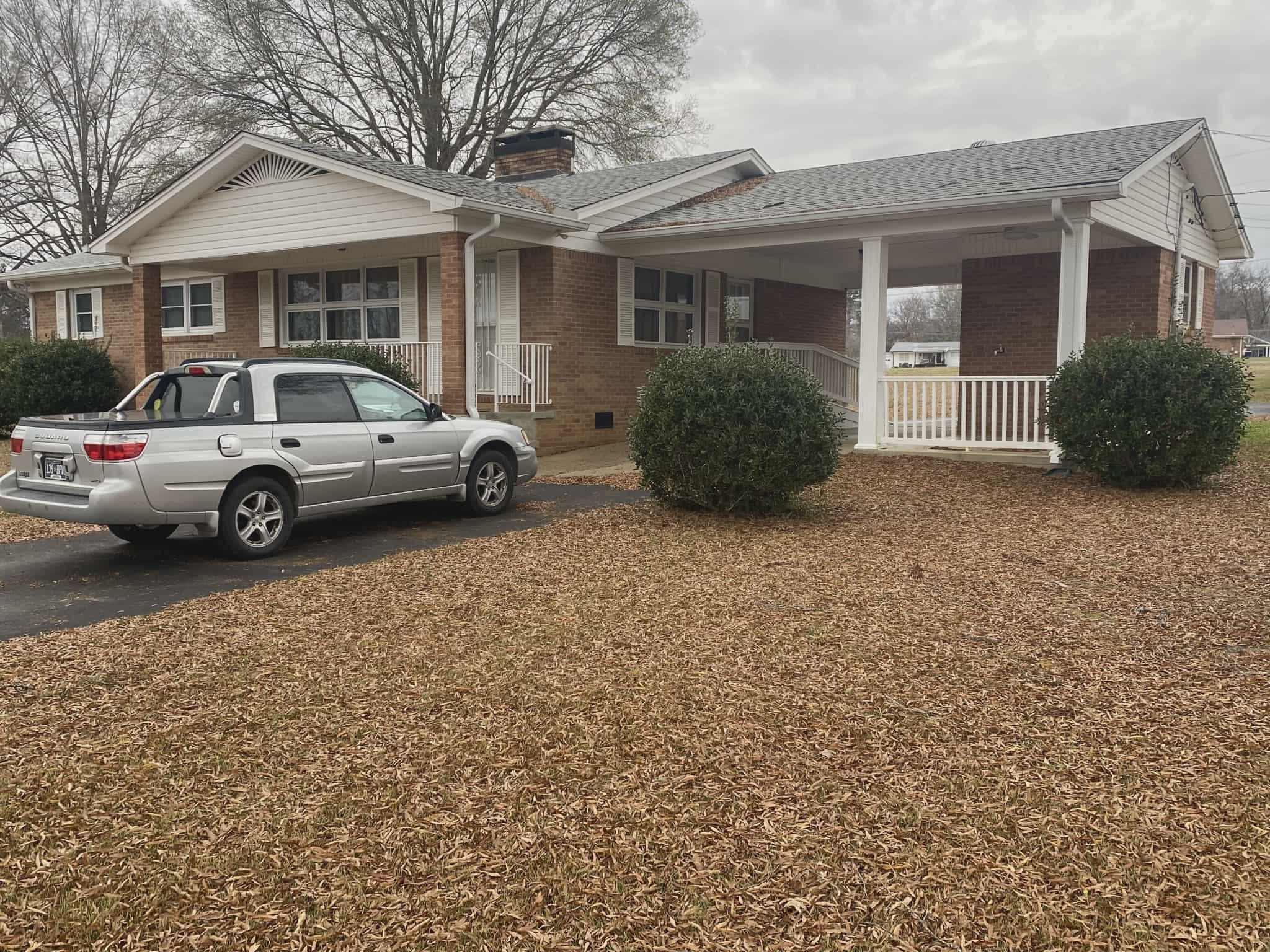 175 Austin Street Savannah, TN 38372 - Photo 33 of 33 a view of multiple house with cars parked in front of a house