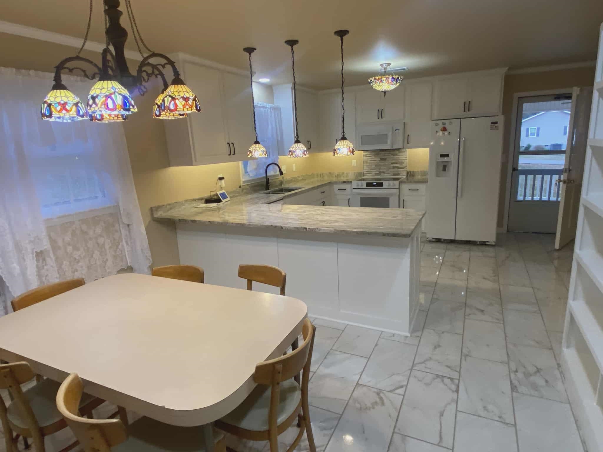 175 Austin Street Savannah, TN 38372 - Photo 7 of 33 a kitchen with stainless steel appliances a sink a counter top space cabinets and counter space