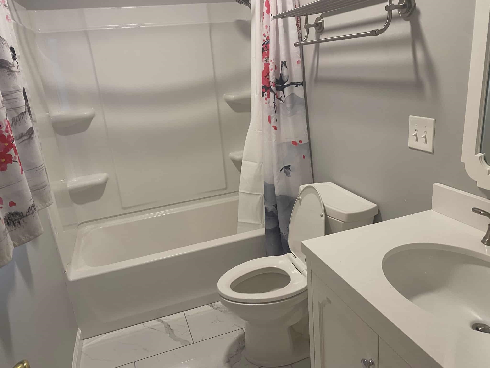 175 Austin Street Savannah, TN 38372 - Photo 10 of 33 a white toilet sitting next to a bath tub