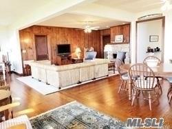 15 Downs Boulevard Jamesport, NY 11970 - Photo 16 of 25 a living room with furniture and a flat screen tv