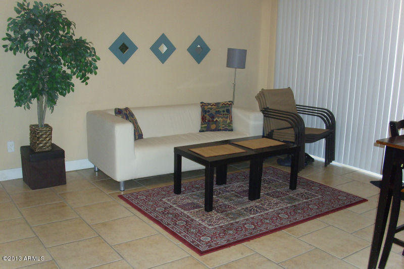 8402 West Berkeley Road Phoenix, AZ 85037 - Photo 3 of 8 Livingroom is Cozy and Spacious at the S