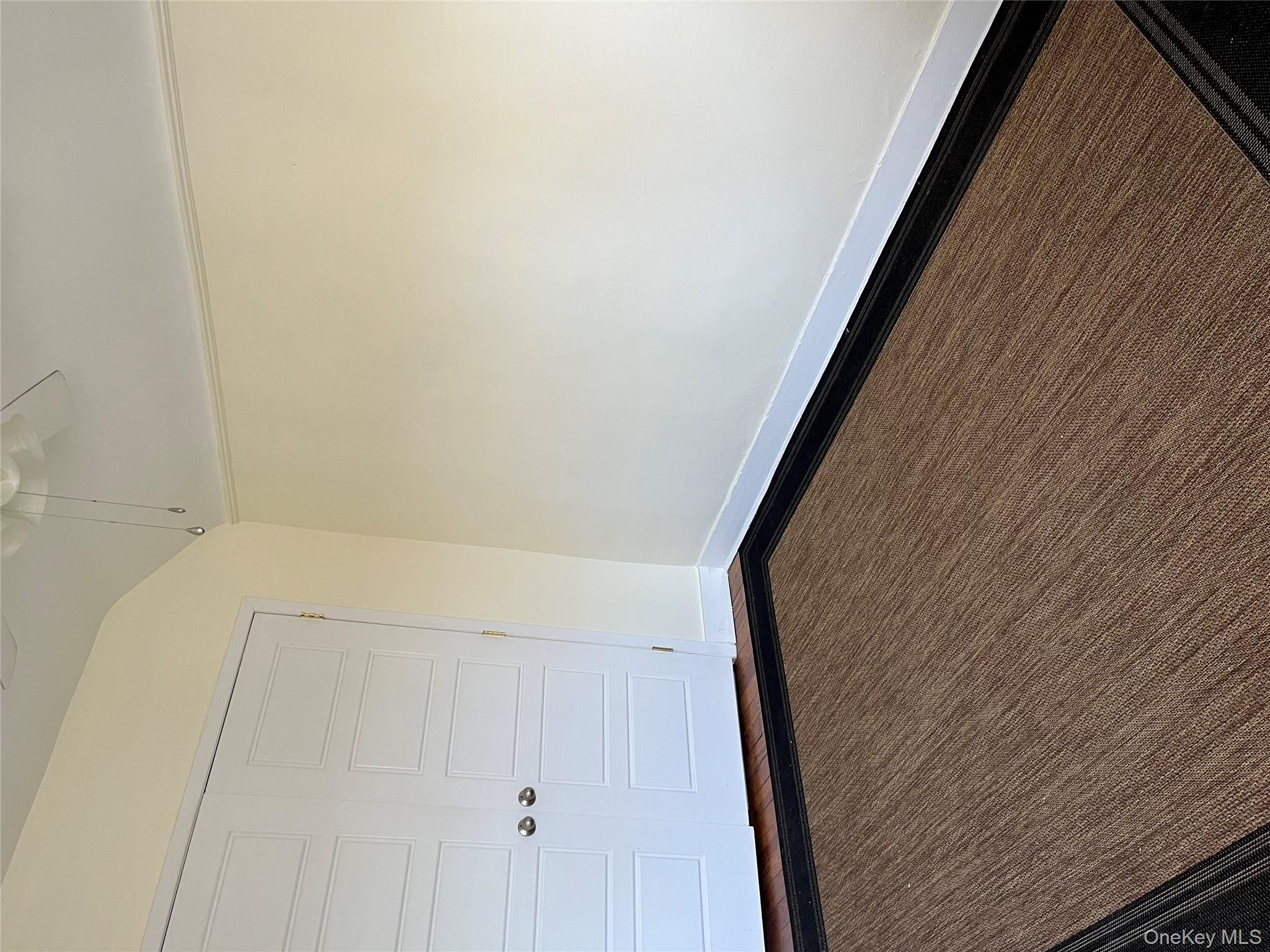 51 Parkway Road, Unit 3 Bronxville, NY 10708 - Photo 13 of 19 a view of an empty room with wooden floor