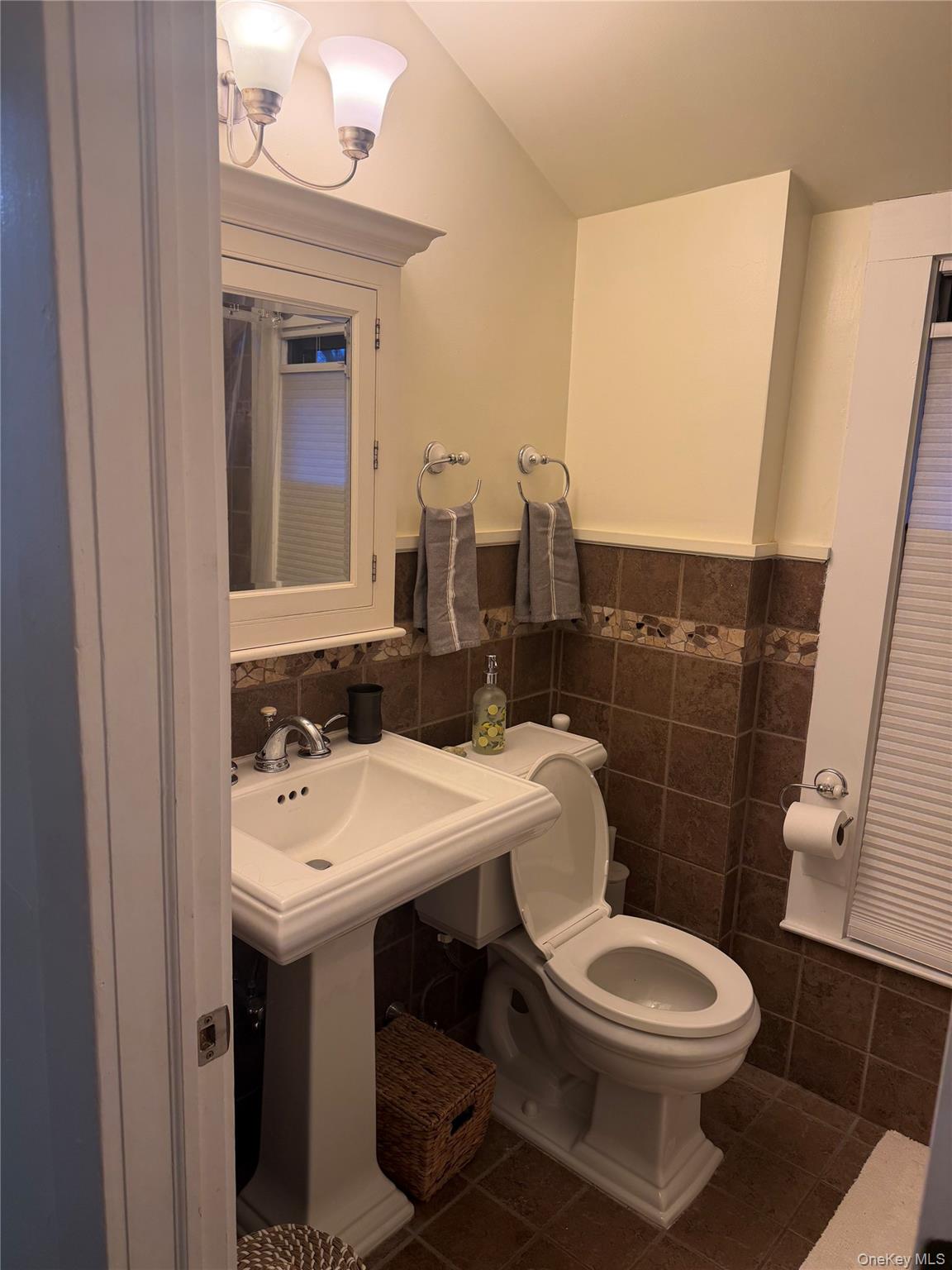 51 Parkway Road, Unit 3 Bronxville, NY 10708 - Photo 18 of 19 a bathroom with a toilet a sink and mirror