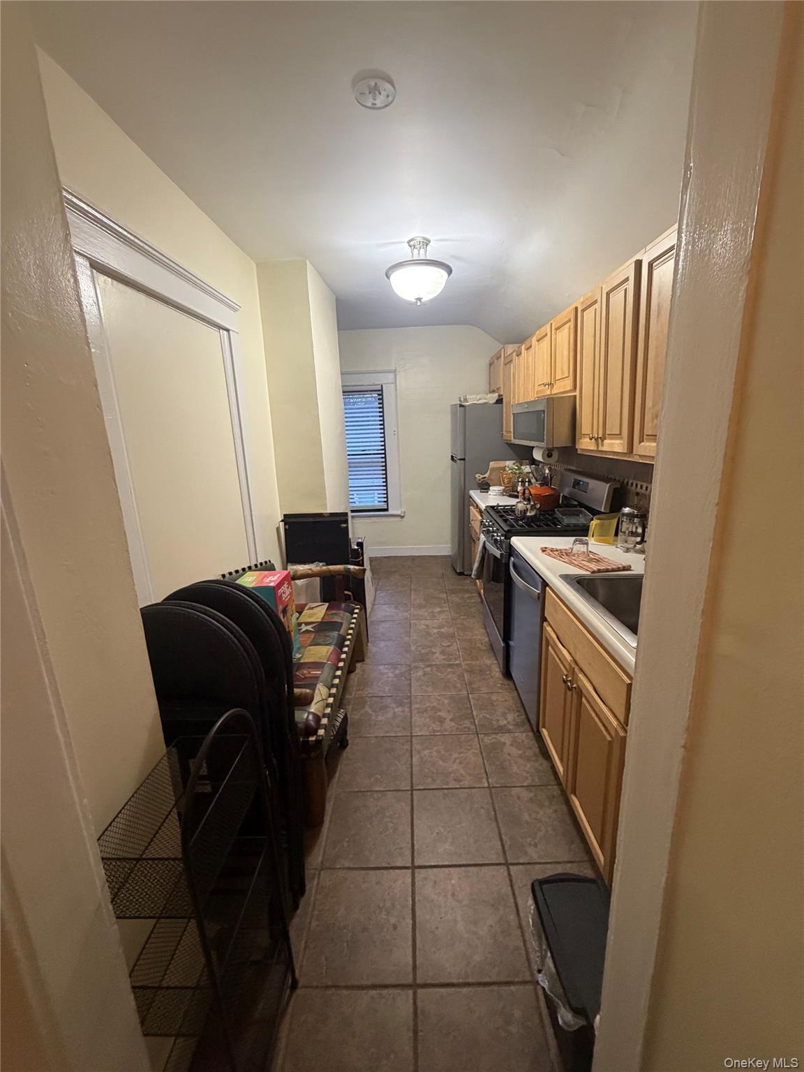 51 Parkway Road, Unit 3 Bronxville, NY 10708 - Photo 18 of 20 a kitchen with a stove a sink and a refrigerator