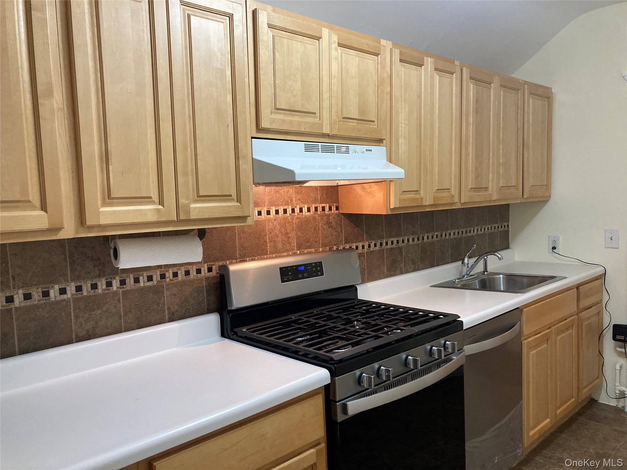 51 Parkway Road, Unit 3 Bronxville, NY 10708 - Photo 20 of 20 a kitchen with granite countertop a sink a stove and cabinets