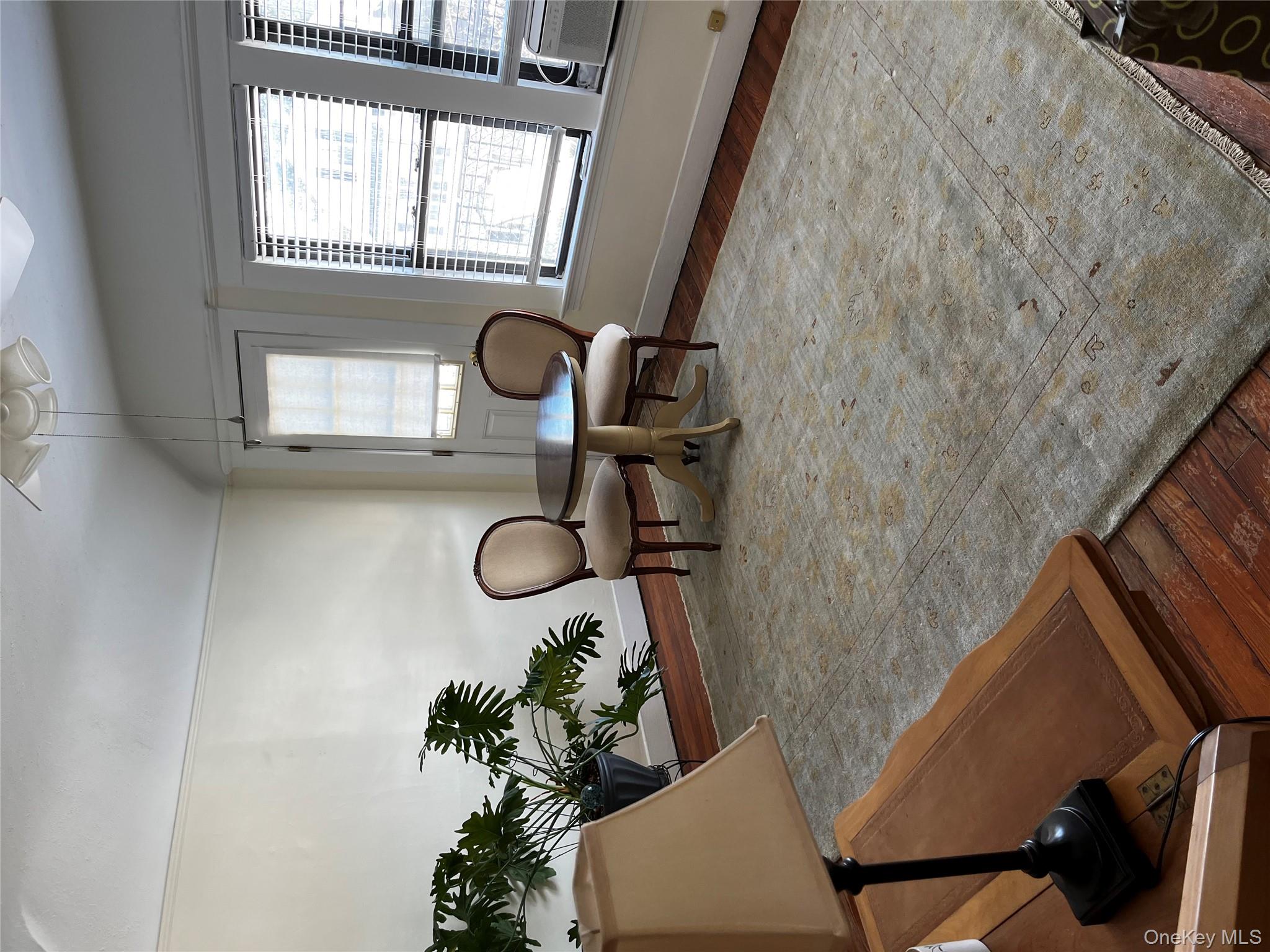 51 Parkway Road, Unit 3 Bronxville, NY 10708 - Photo 8 of 19 a living room with furniture flowerpot and window