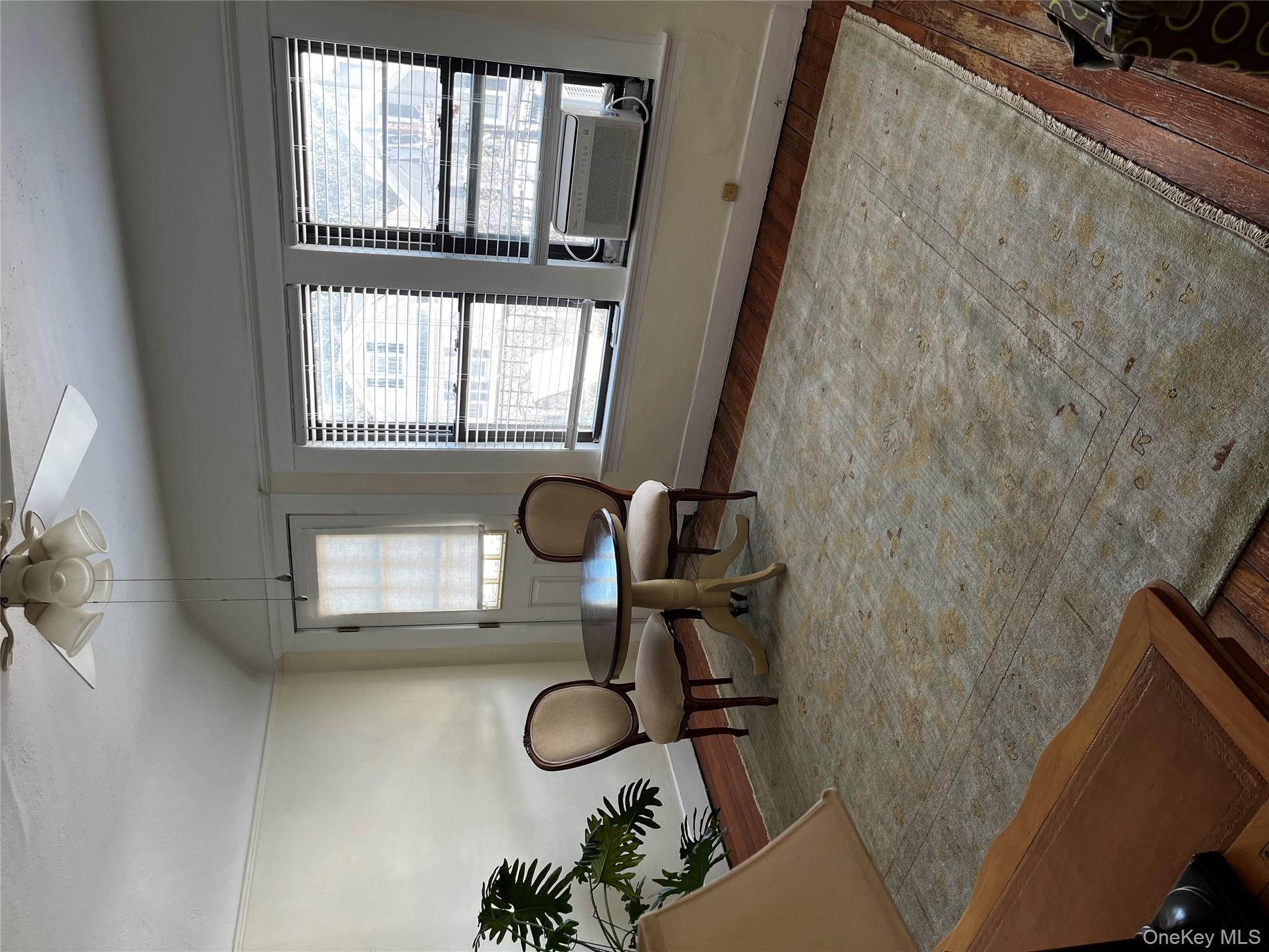 51 Parkway Road, Unit 3 Bronxville, NY 10708 - Photo 8 of 20 a living room with furniture and a large window