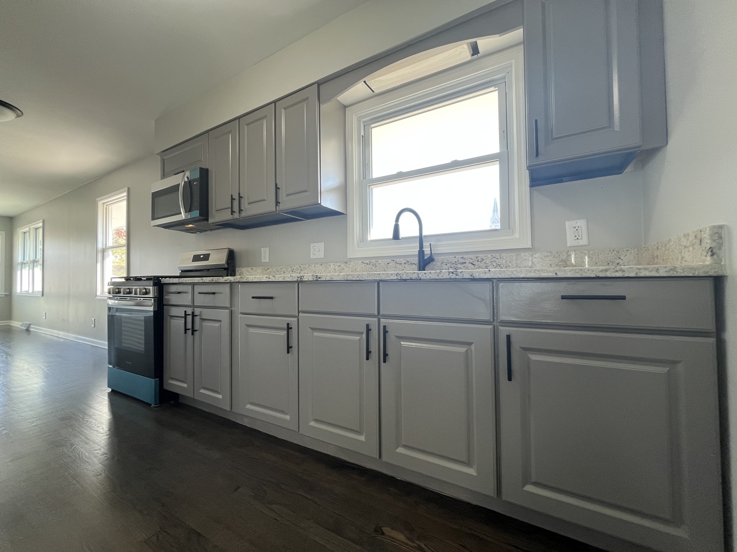 701 Lundy Street Streator, IL 61364 - Photo 4 of 21 a kitchen with stainless steel appliances granite countertop a sink a stove and cabinets