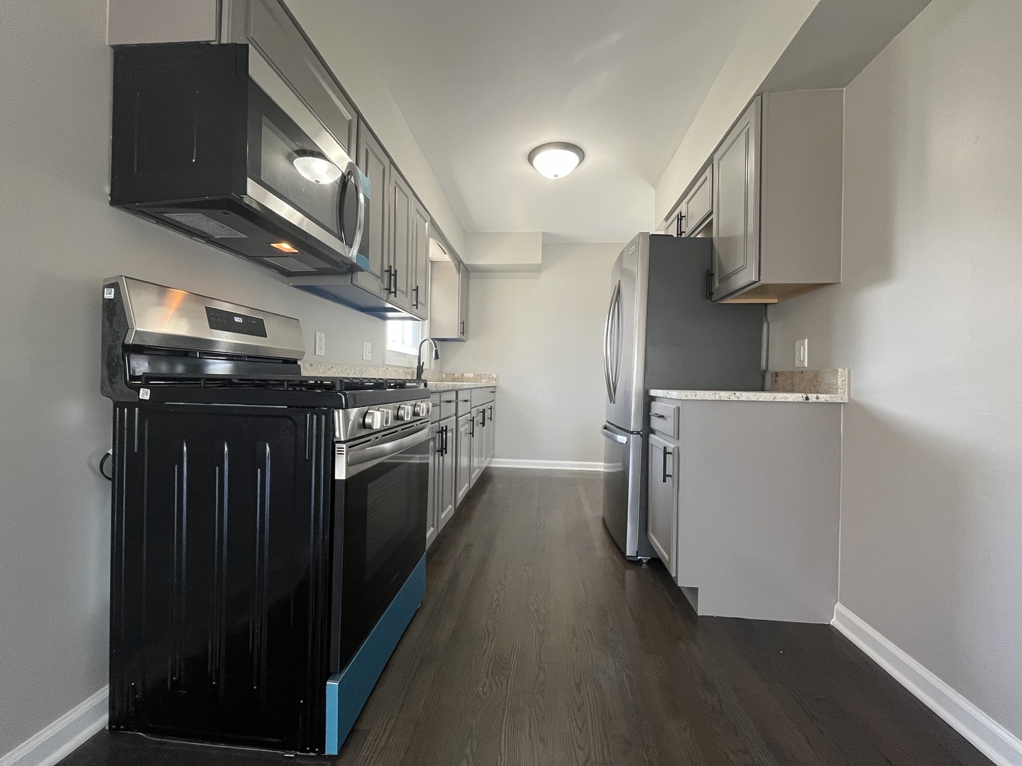 701 Lundy Street Streator, IL 61364 - Photo 5 of 21 a kitchen with stainless steel appliances granite countertop a stove and a refrigerator