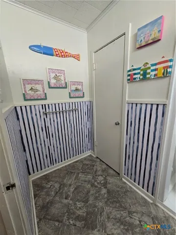 a view of a hallway to rooms