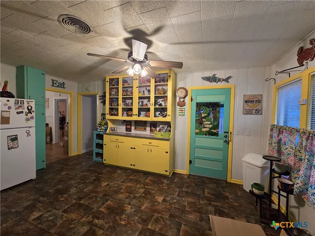 a room with a bed and furniture