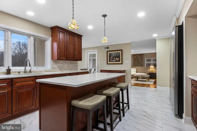 a view of a dining room with furniture large windows and wooden floor