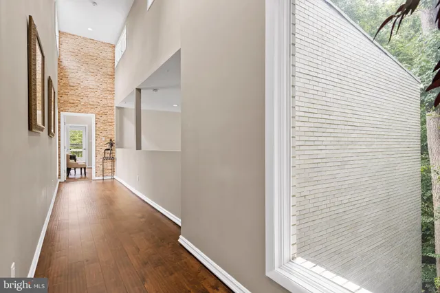 a view of a hallway with windows
