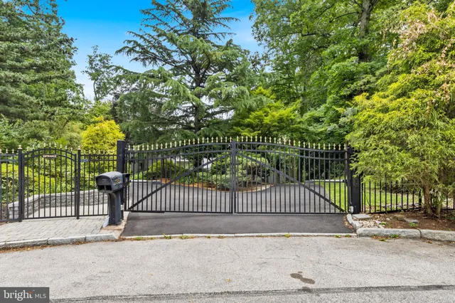 a view of a gate and fence