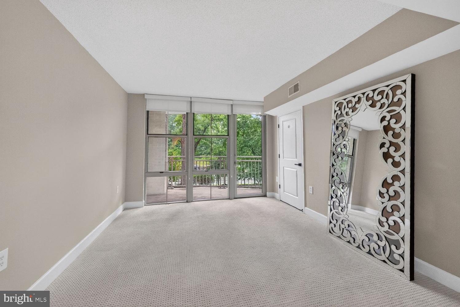 11800 Sunset Hills Road, Unit 314 Reston, VA 20190 - Photo 19 of 50 a large white bed with a large window