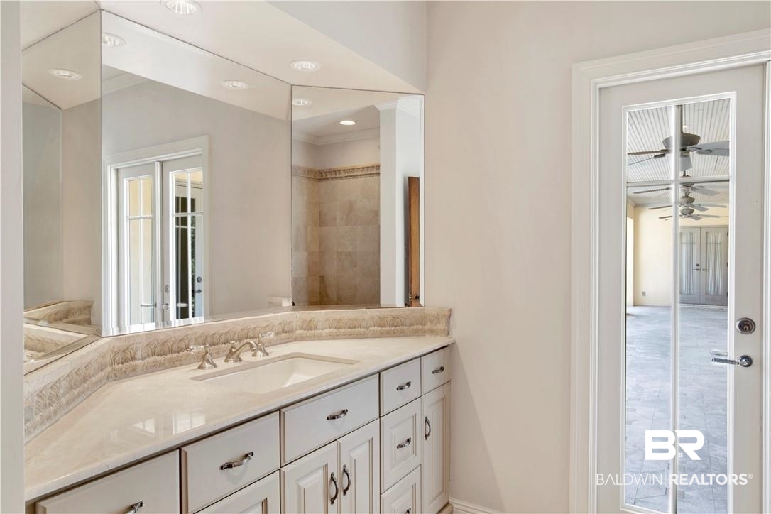 4 Chancery Court Mobile, AL 36608 - Photo 34 of 54 Bathroom with ornamental molding, ceiling fan, vanity, and toilet