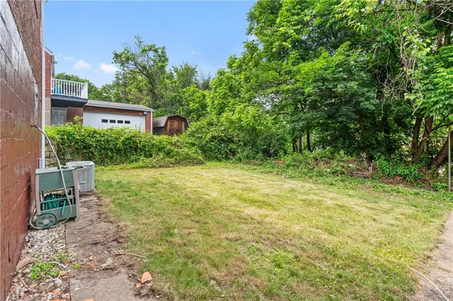 a view of a chairs in a backyard of a house
