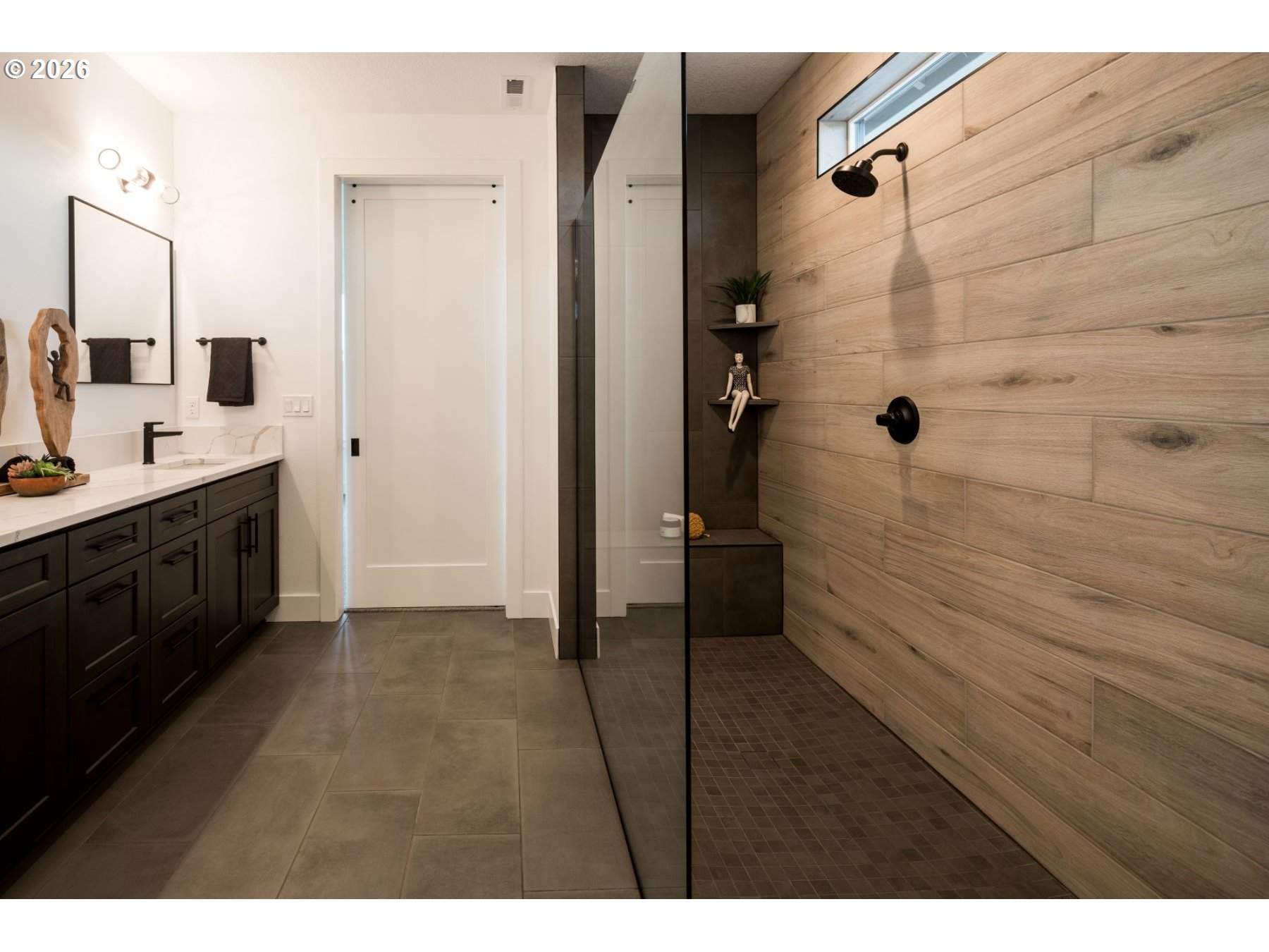 2072 South River Road Kelso, WA 98626 - Photo 7 of 20 a bathroom with a double vanity sink a toilet and shower