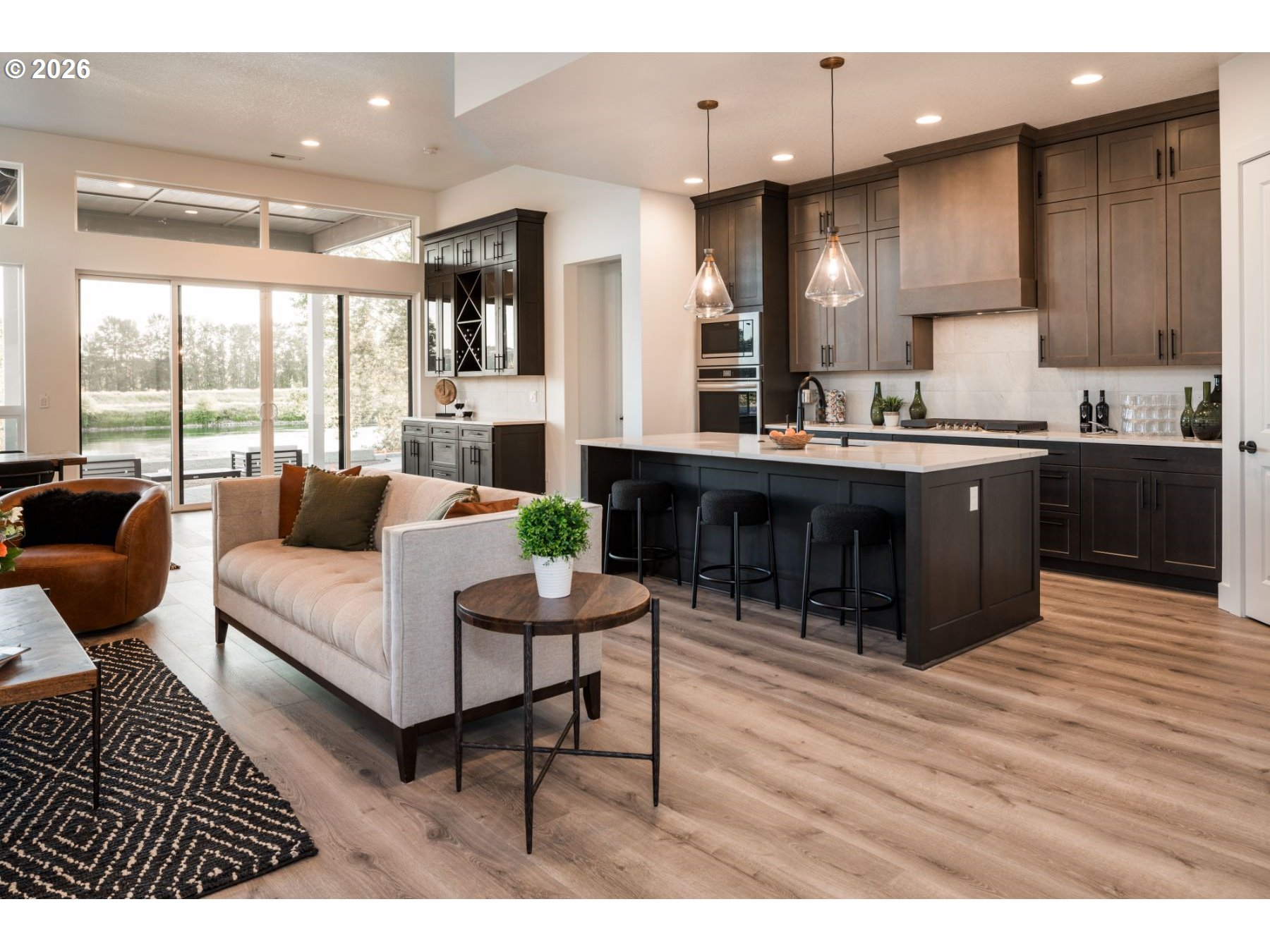 2072 South River Road Kelso, WA 98626 - Photo 10 of 20 a living room with furniture a wooden floor and kitchen view