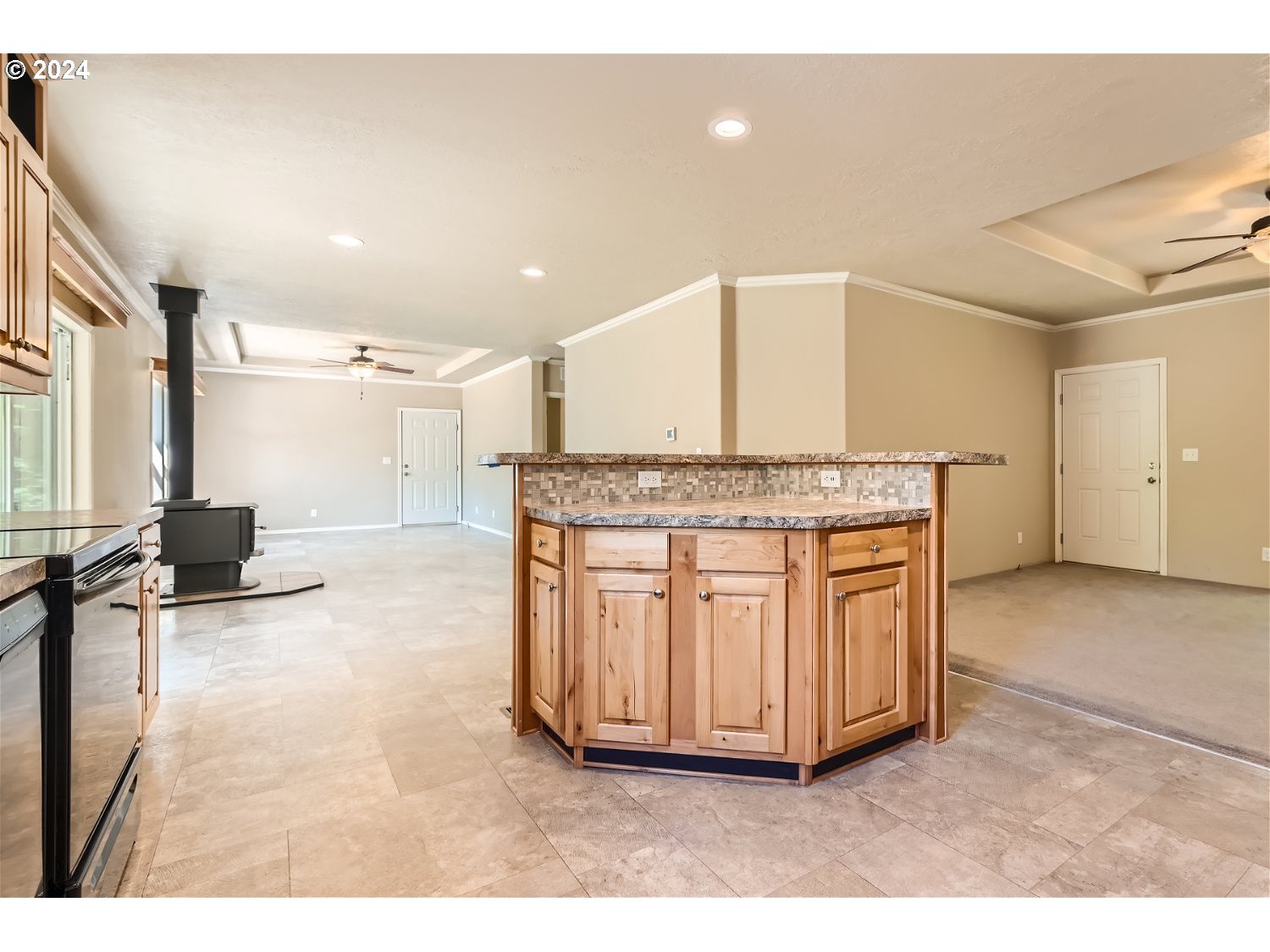 42290 Southeast Shipley Road Sandy, OR 97055 - Photo 6 of 17 a kitchen with granite countertop a stove and cabinets