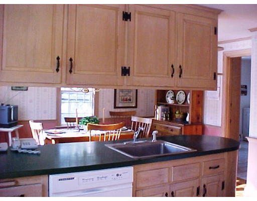 23 Salem Road Wellesley, MA 02481 - Photo 5 of 11 a kitchen with granite countertop a stove and cabinets