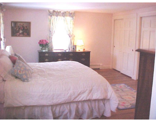 23 Salem Road Wellesley, MA 02481 - Photo 8 of 11 a bedroom with a bed and a window