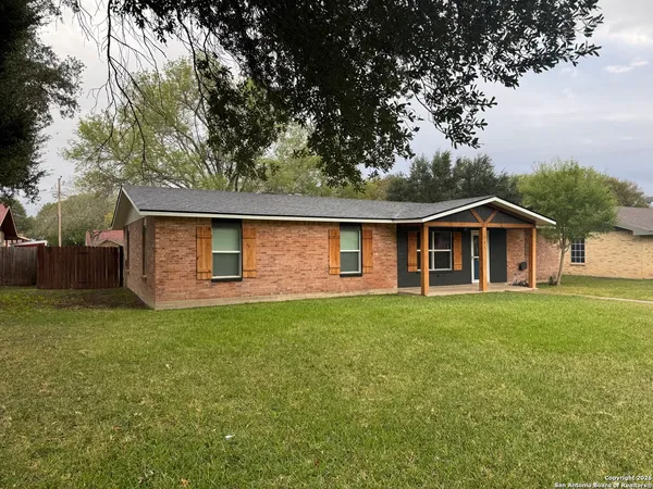 a front view of a house with yard