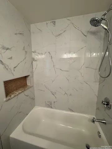 a bathroom with a sink and a shower