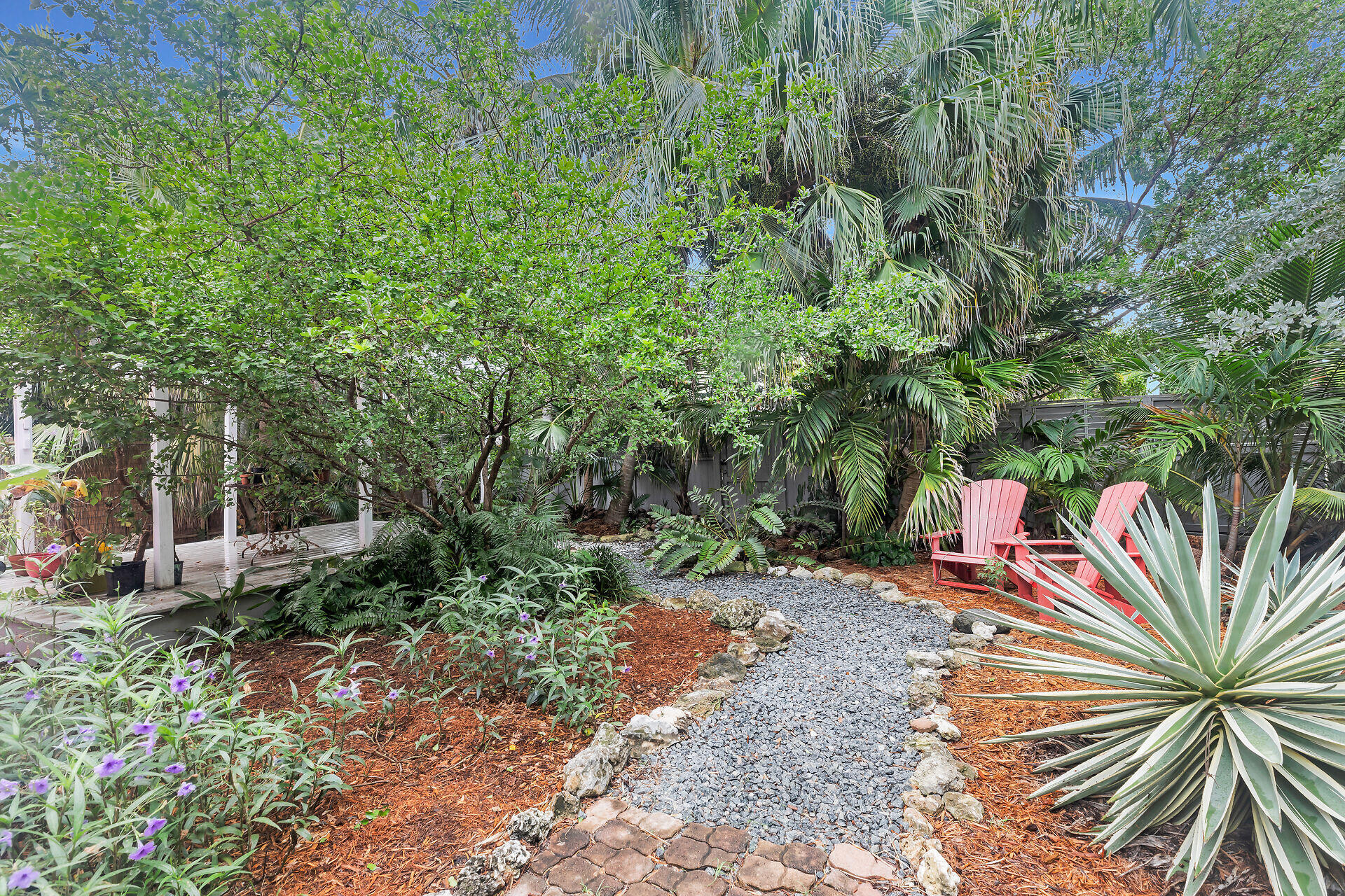 1301 Atlantic Drive Key West, FL 33040 - Photo 21 of 37 a backyard of a house with lots of green space and fountain