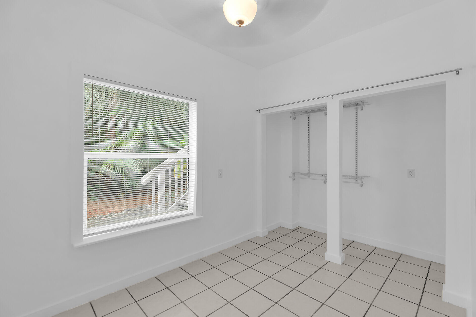 1301 Atlantic Drive Key West, FL 33040 - Photo 33 of 37 a view of an empty room with window and cabinet