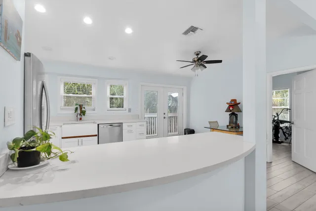 a view of living room with furniture and a chandelier