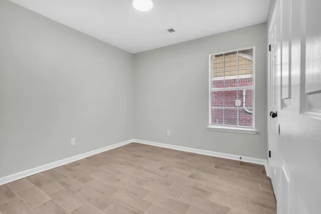 a view of cabinets a sink with wooden floor
