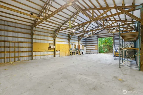 an aerial view of a house with green space