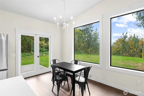 a view of a dining room with furniture window and outside view