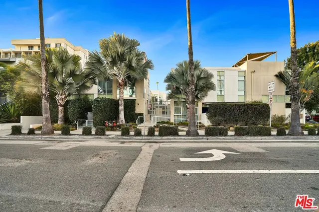 a view of a street with cars