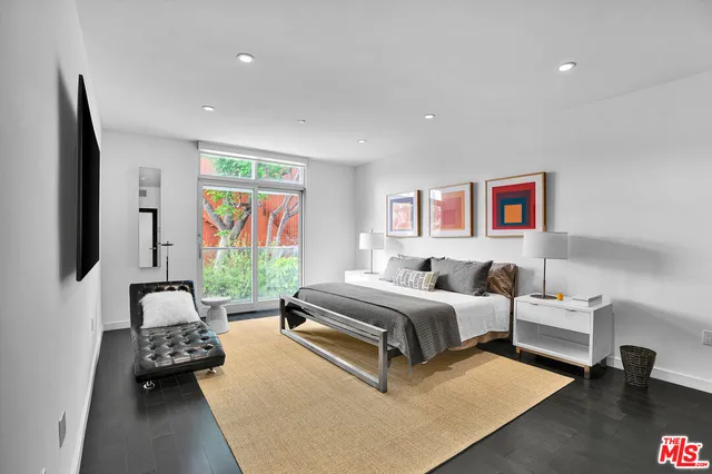 a bedroom with a bed and furniture