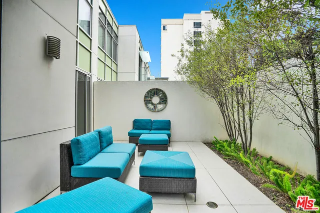 a couple of cars parked in front of a house