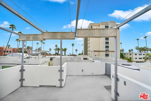 a kitchen with cabinets and window