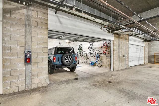 a view of parking garage with cars