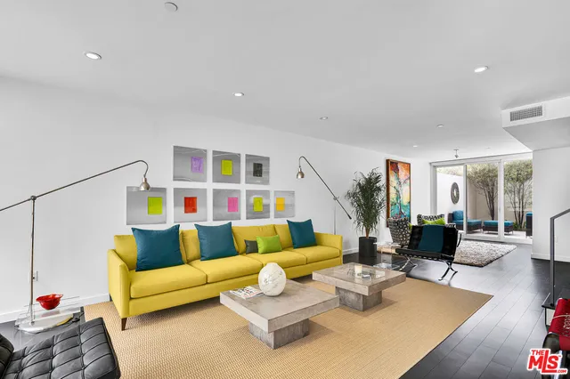 a living room with furniture and a couch