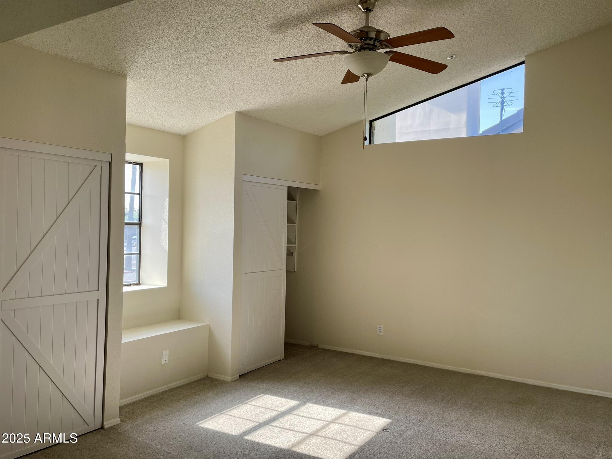 1124 East Rose Lane, Unit 3 Phoenix, AZ 85014 - Photo 12 of 32 a view of an empty room with a window