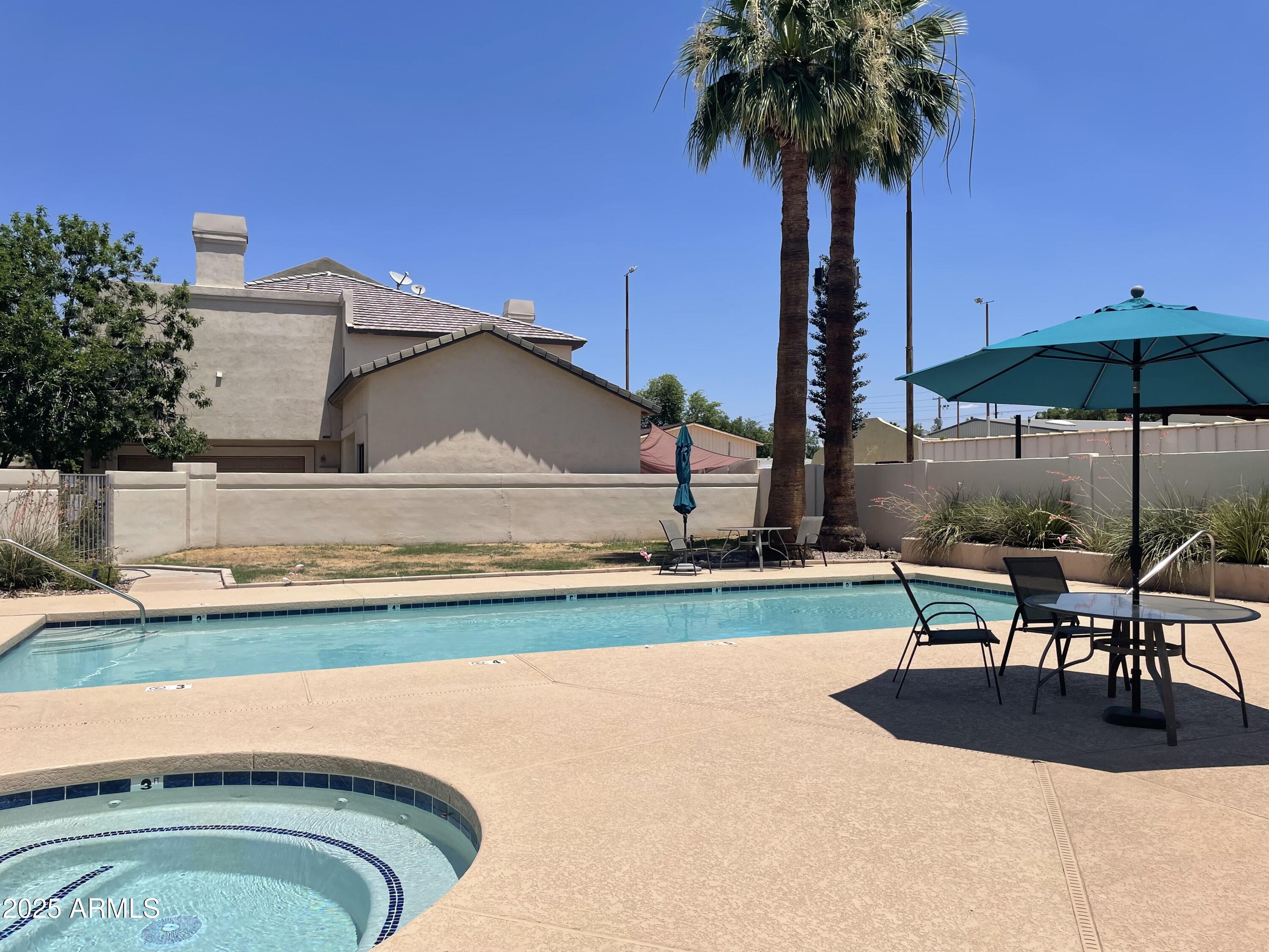 1124 East Rose Lane, Unit 3 Phoenix, AZ 85014 - Photo 21 of 32 swimming pool view with a seating space