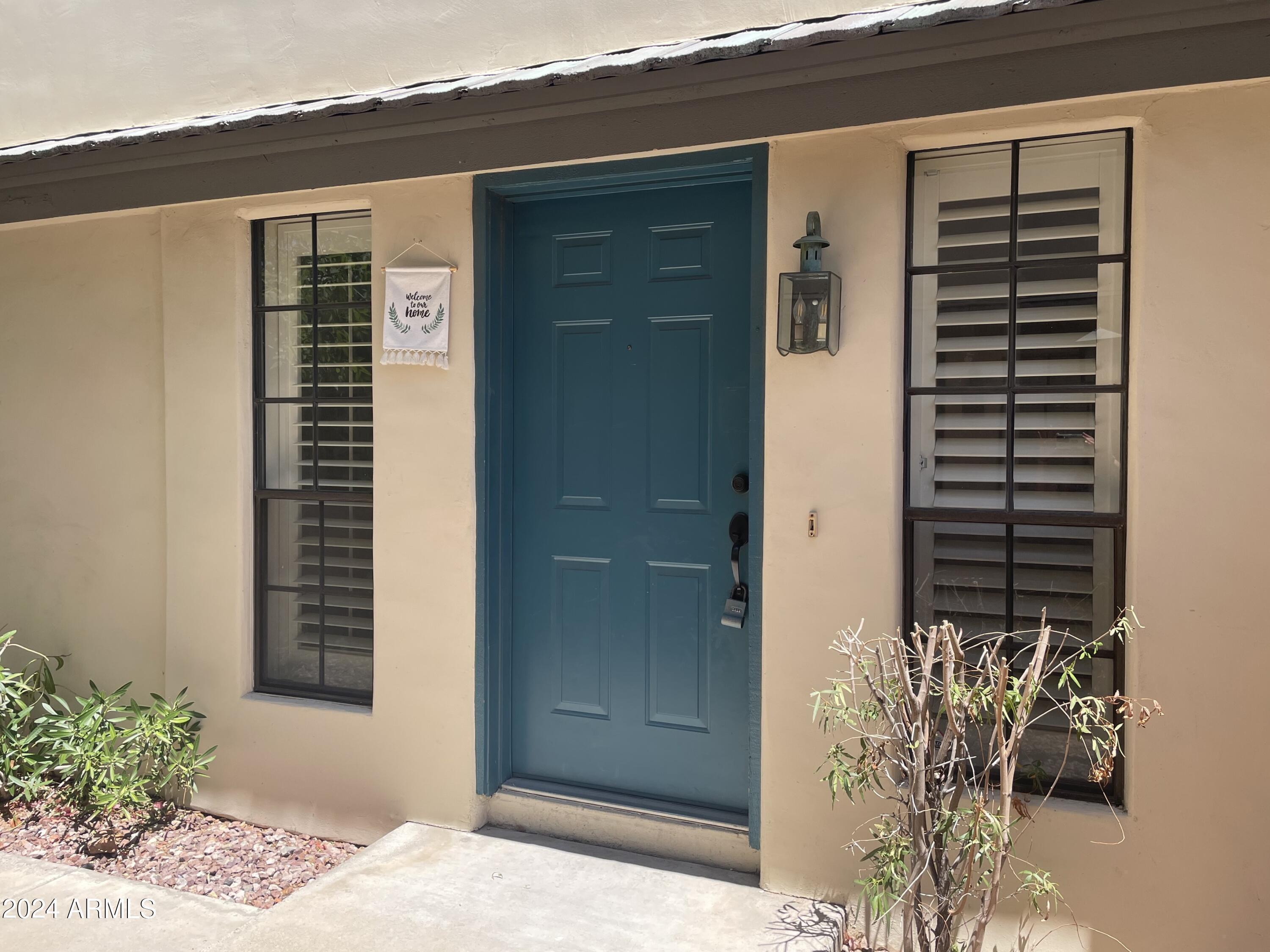 1124 East Rose Lane, Unit 3 Phoenix, AZ 85014 - Photo 24 of 32 a view of potted plant in front of a door