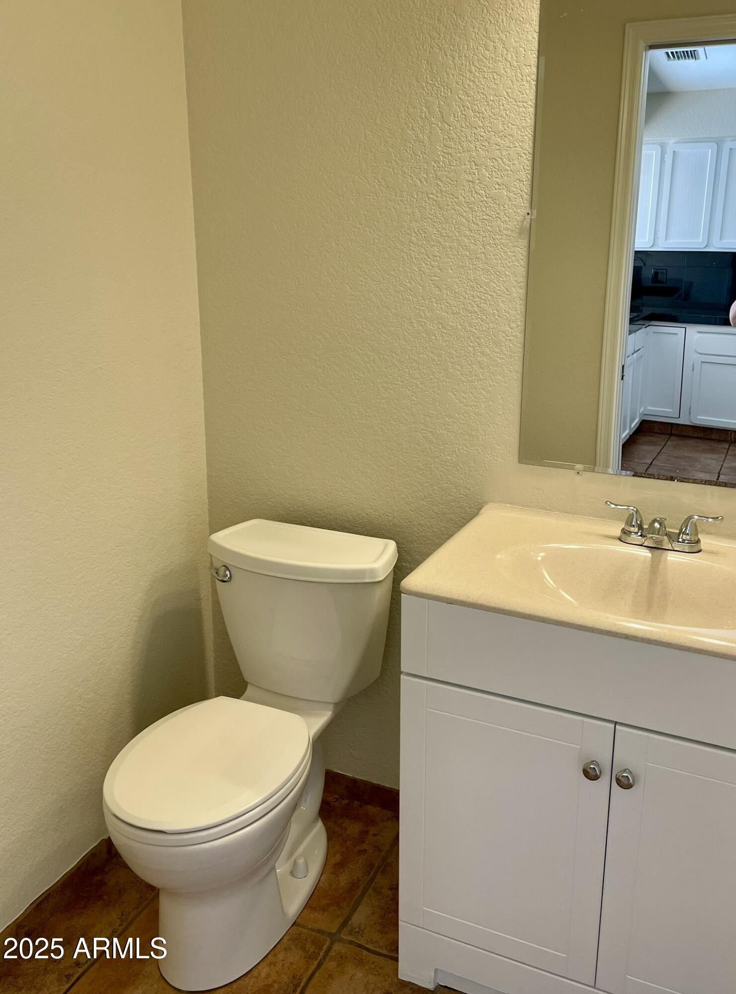 1124 East Rose Lane, Unit 3 Phoenix, AZ 85014 - Photo 6 of 32 a bathroom with a toilet and a sink