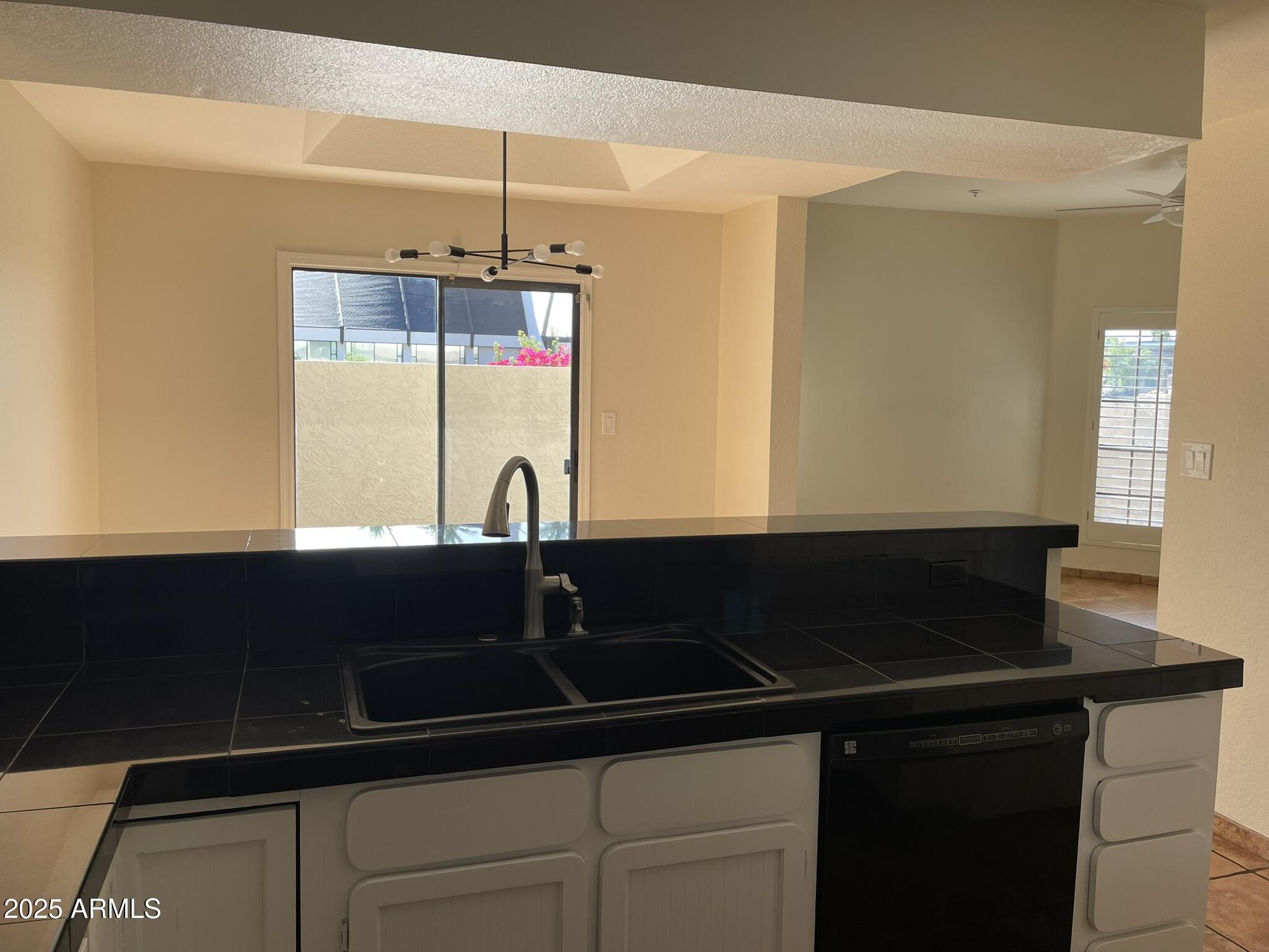 1124 East Rose Lane, Unit 3 Phoenix, AZ 85014 - Photo 9 of 32 a close view of sink and table